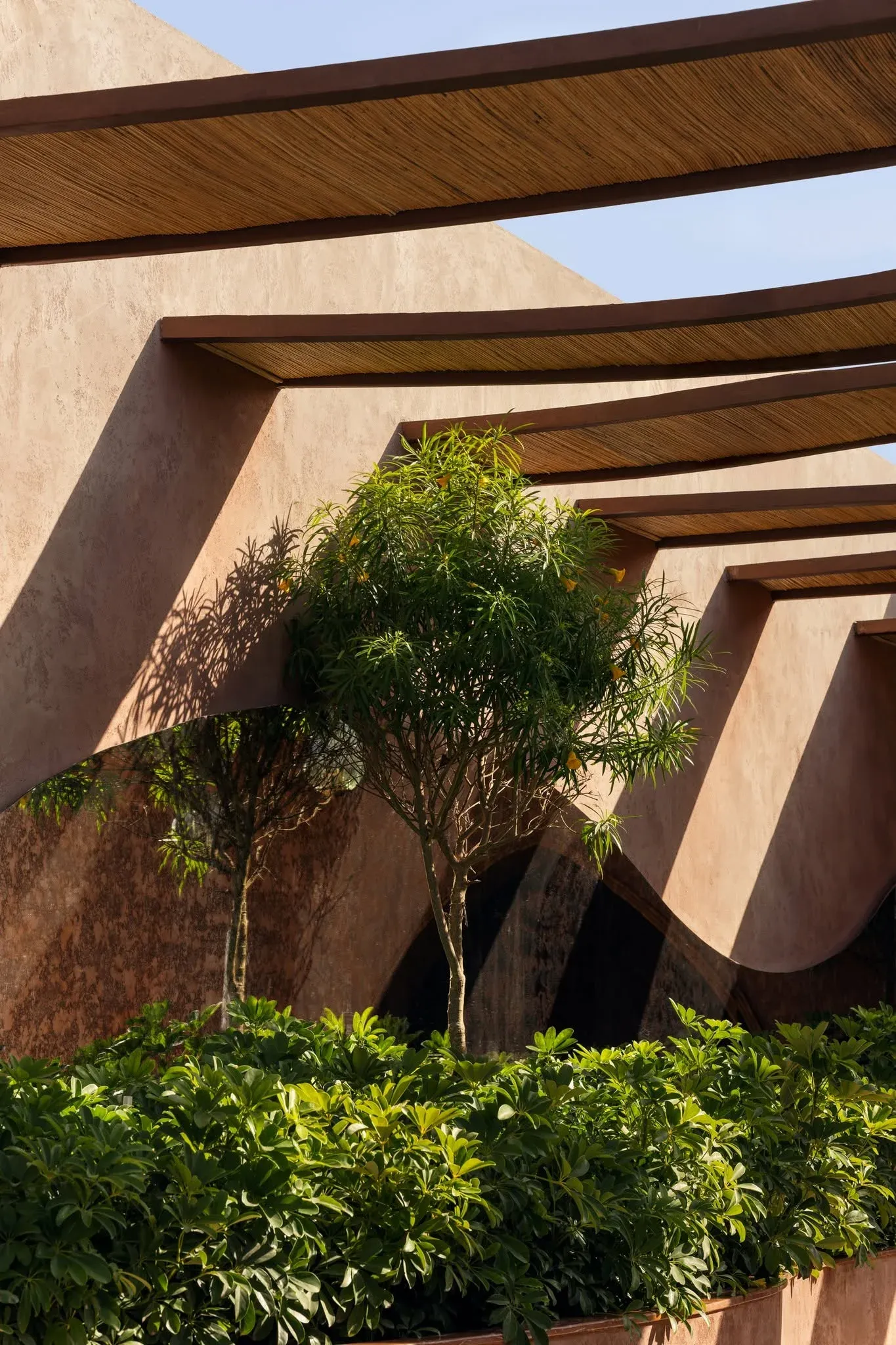 Terracotta arches and steel structure on a beachfront resort build